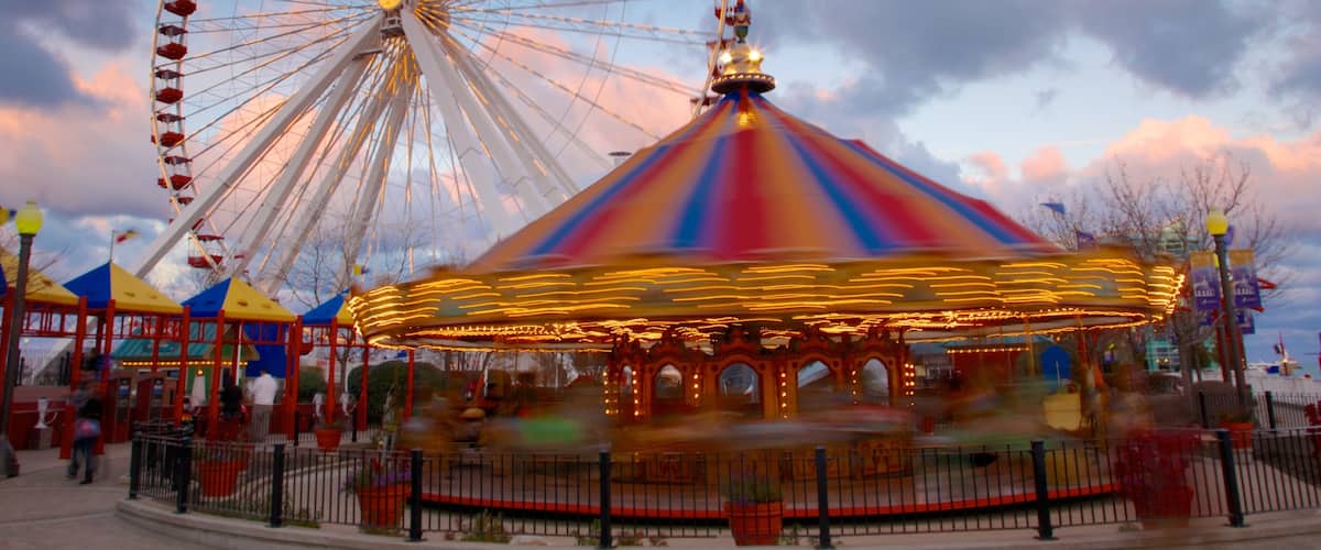 Navy Pier which includes rides and a sunset