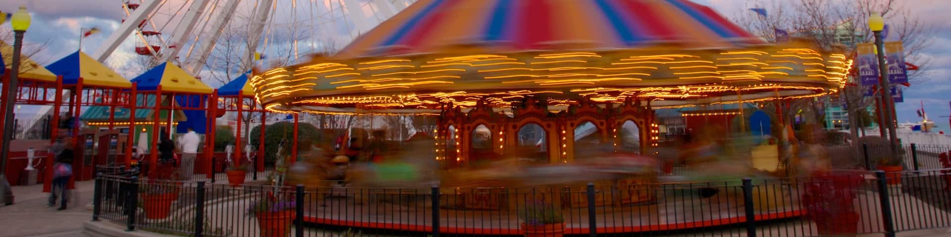 Navy Pier which includes rides and a sunset
