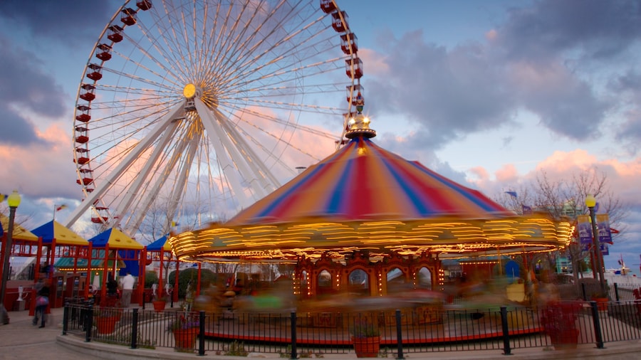 Ferris wheel and carousel at Navy Pier with Lake Michigan in the background.