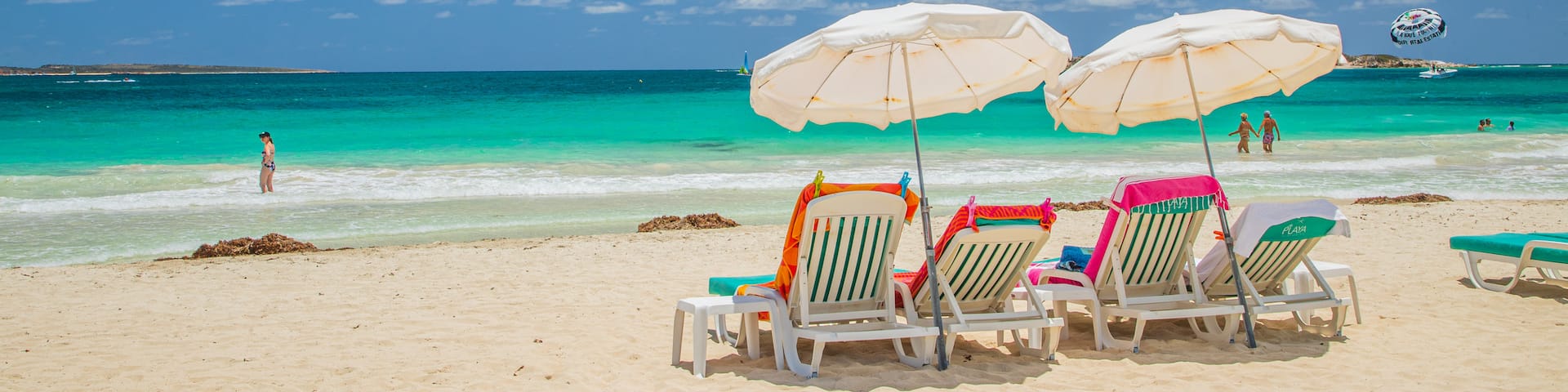 Orient Bay Beach featuring a sandy beach, tropical scenes and general coastal views