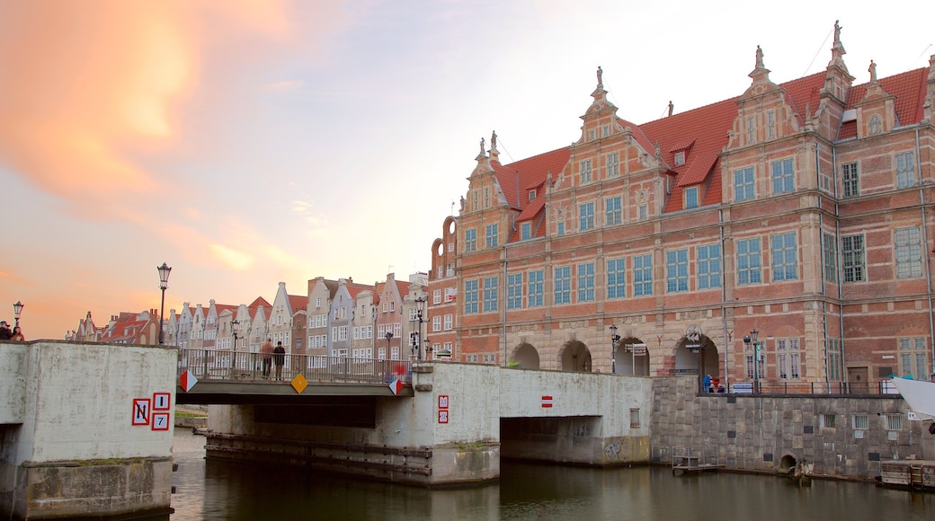 Old Town Gdańsk featuring heritage elements, a river or creek and a sunset