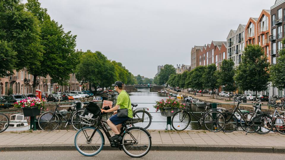 Oud-West featuring a river or creek, cycling and street scenes
