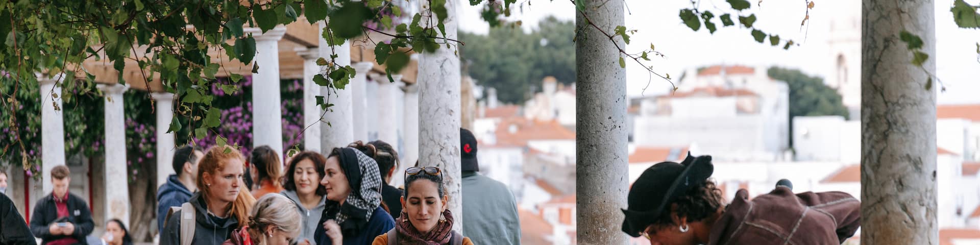 Lisbon Old Town showing music and street performance as well as an individual male