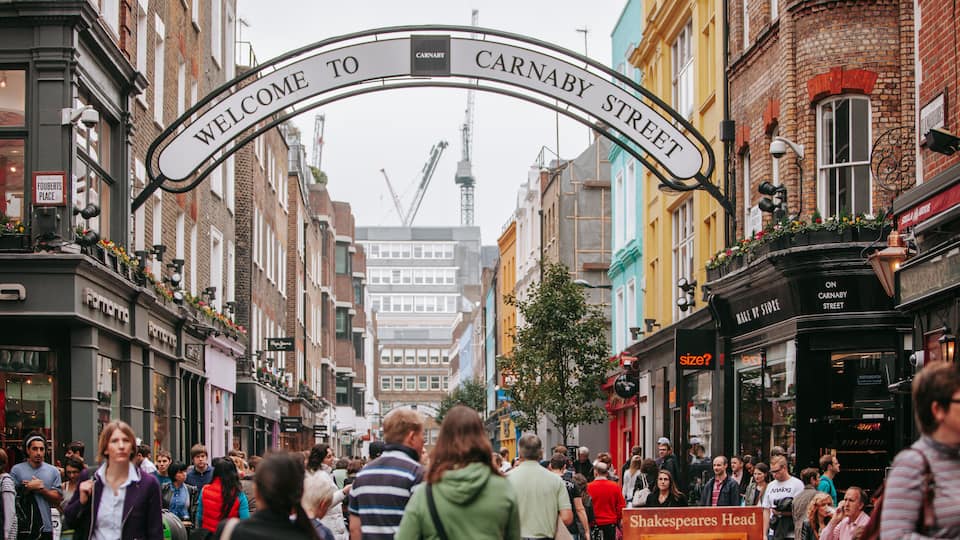 West End which includes a city, street scenes and signage