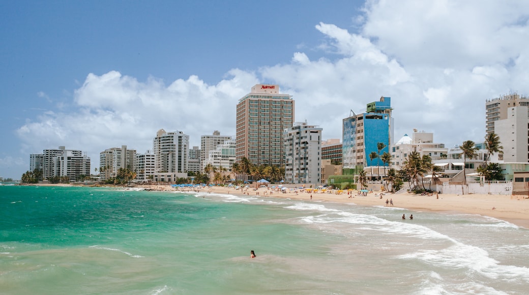 Condado Beach which includes general coastal views and a coastal town