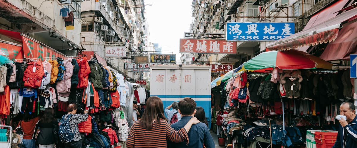 Sham Shui Po showing markets and street scenes as well as a couple
