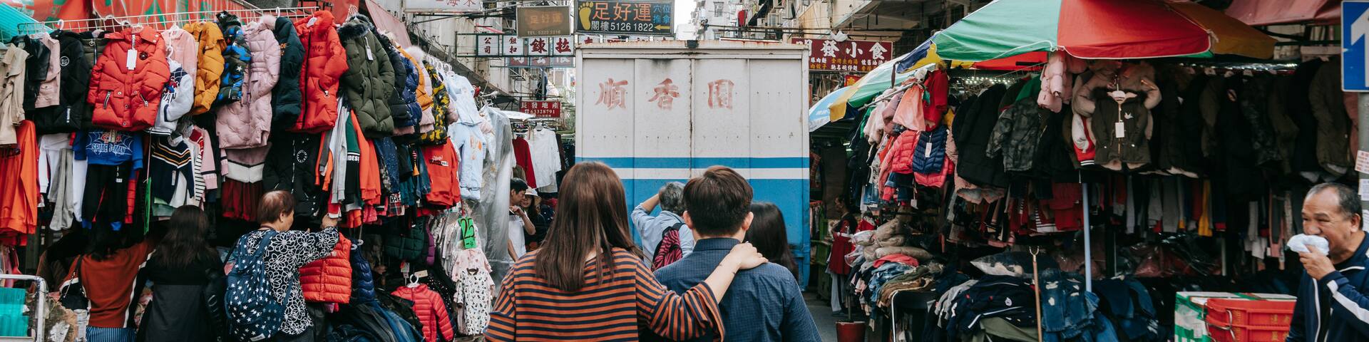 Sham Shui Po showing markets and street scenes as well as a couple