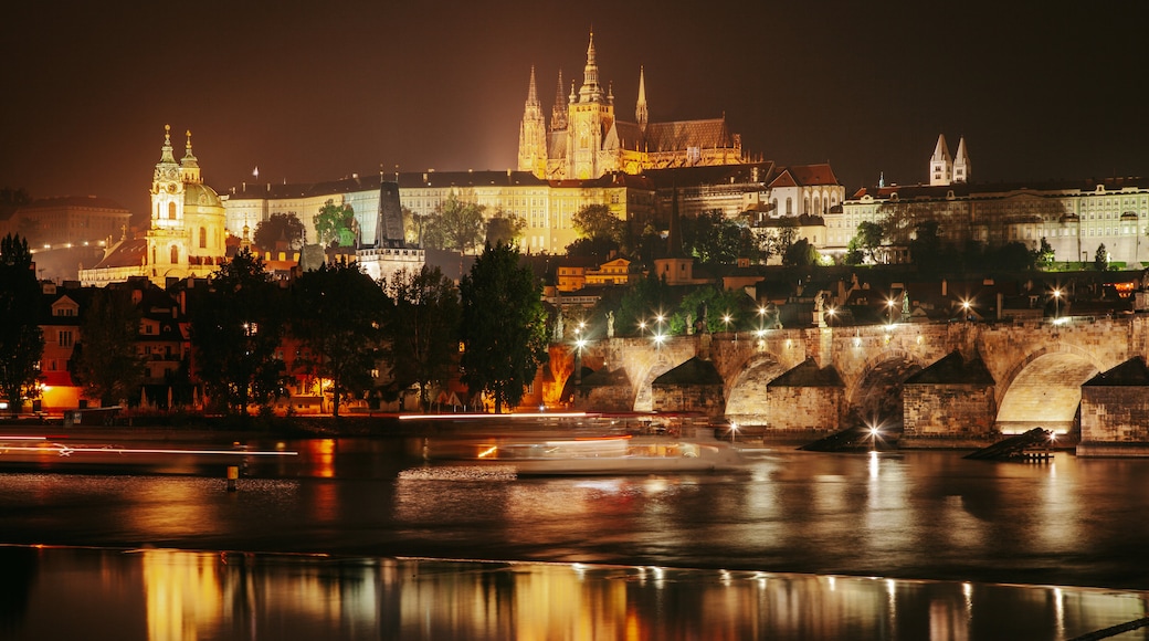 Prague Castle which includes night scenes and a city