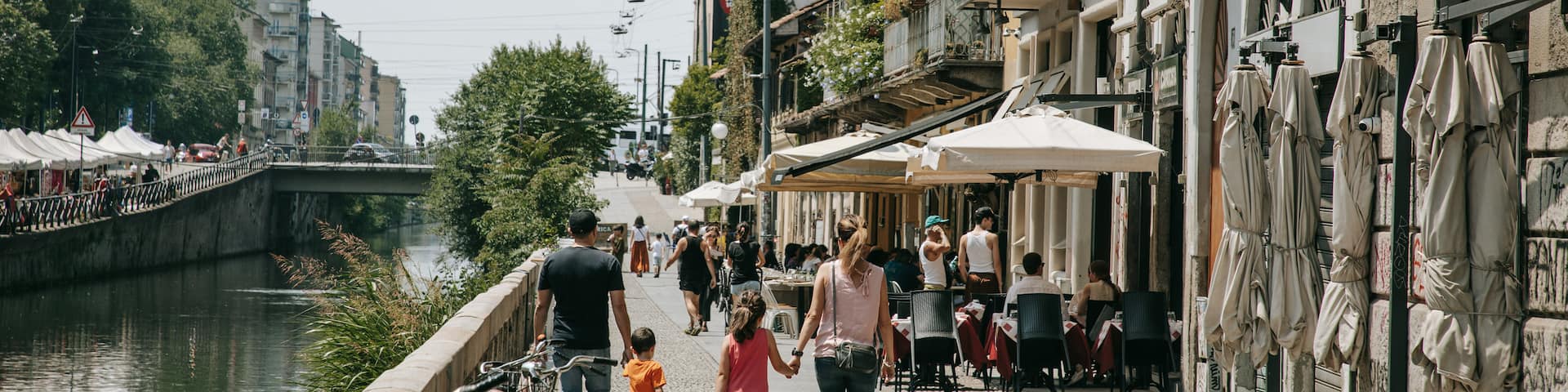 Porta Genova featuring street scenes and a city as well as a family