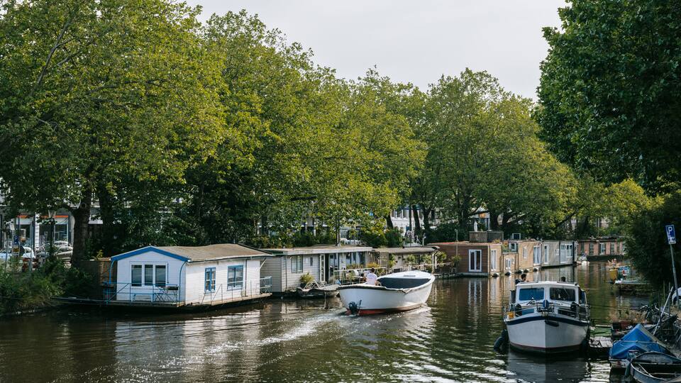 De Pijp featuring a river or creek and boating