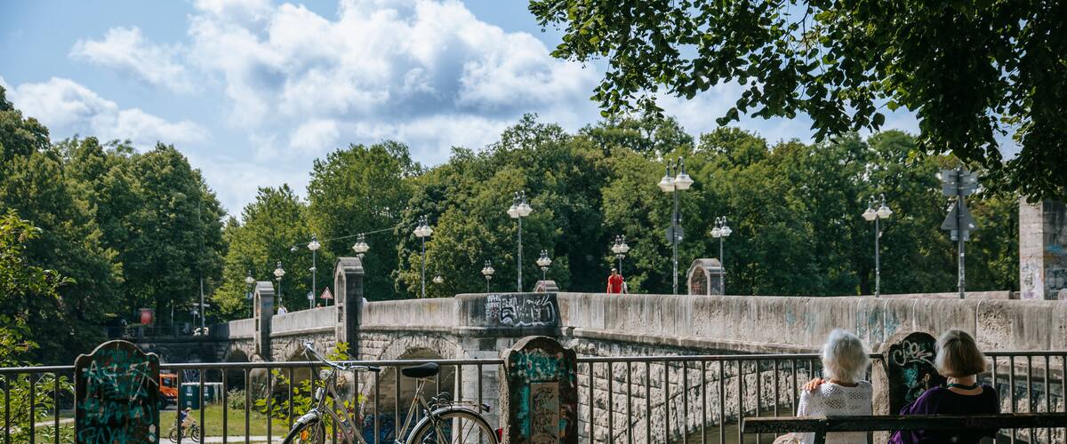 Isarvorstadt featuring a bridge and a park as well as a couple