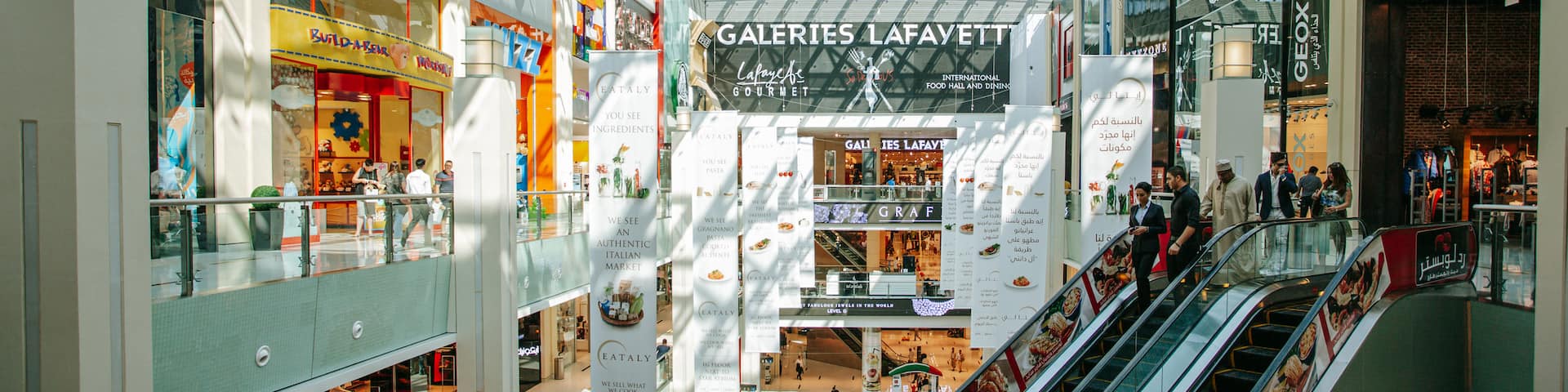 Dubai Mall featuring interior views, shopping and signage