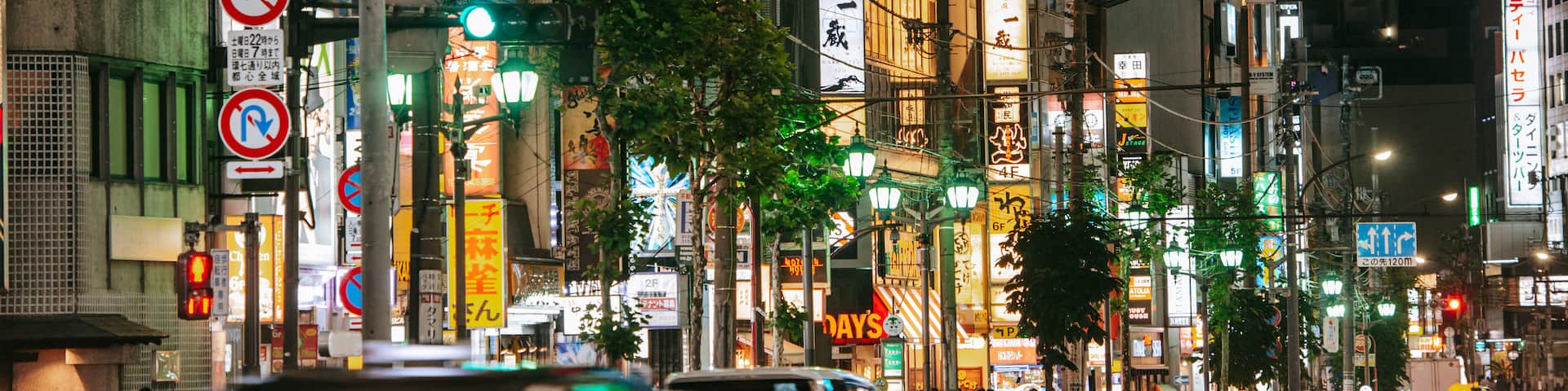 Roppongi which includes night scenes, street scenes and a city