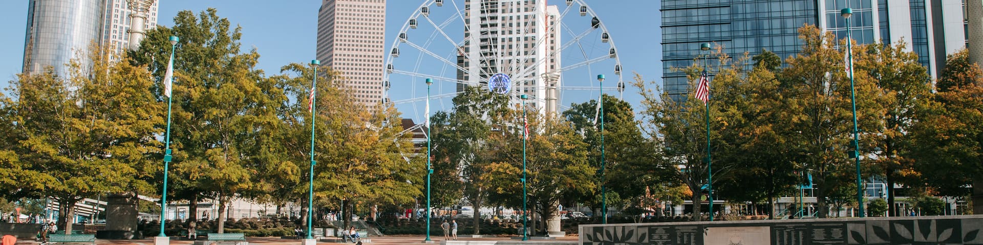 Centennial Olympic Park which includes a fountain and a square or plaza as well as a family