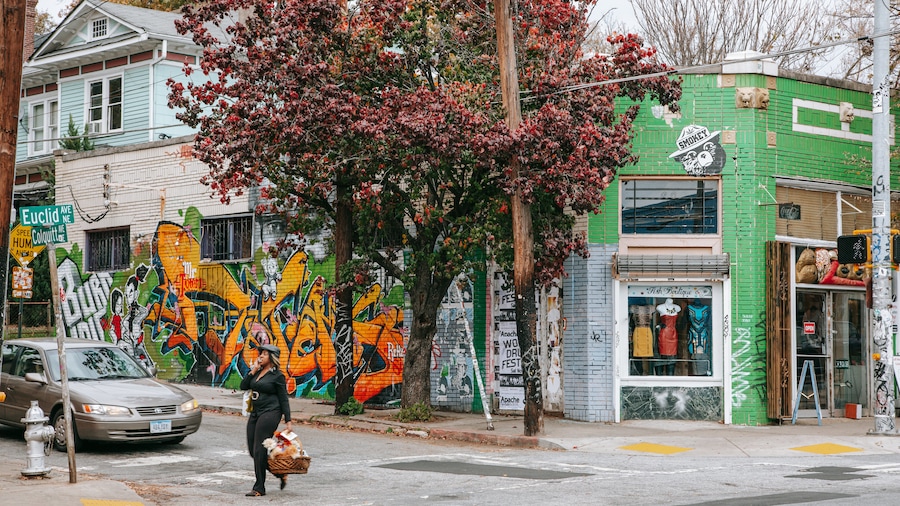 Street view of Little Five Points with colorful murals and indie shops in Atlanta, Georgia.