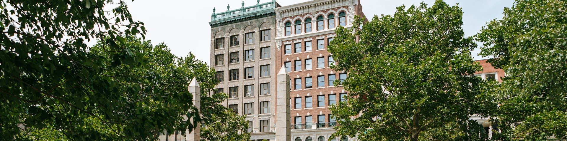 Back Bay which includes a fountain and a river or creek as well as a small group of people