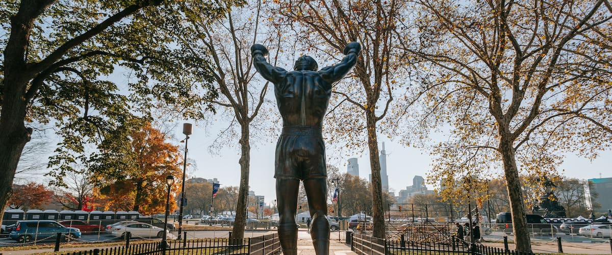 Rocky Statue showing a park and a statue or sculpture
