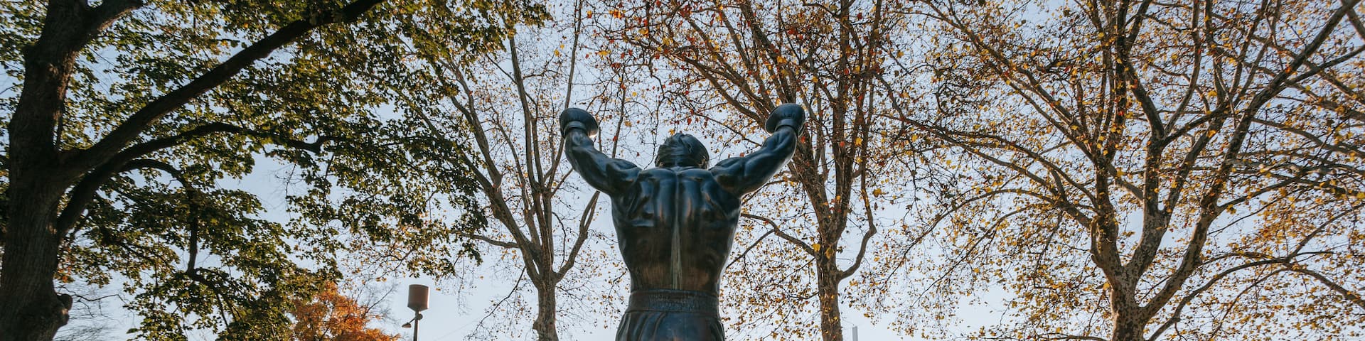Rocky Statue showing a park and a statue or sculpture