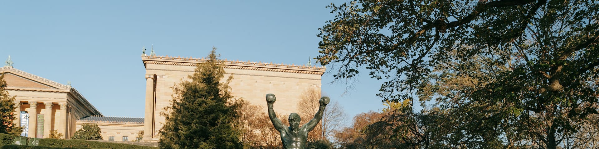 Rocky Statue showing a statue or sculpture as well as a couple
