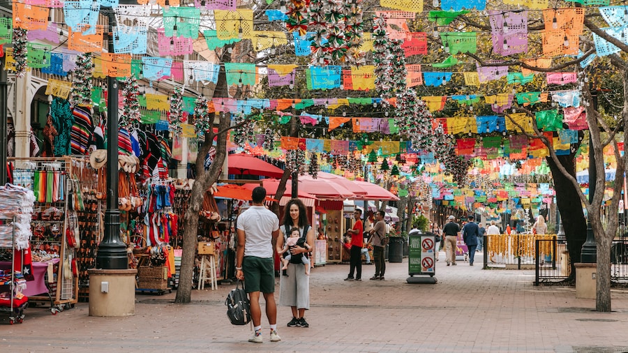 Historic Market Square in San Antonio with colorful stalls and festive decorations.