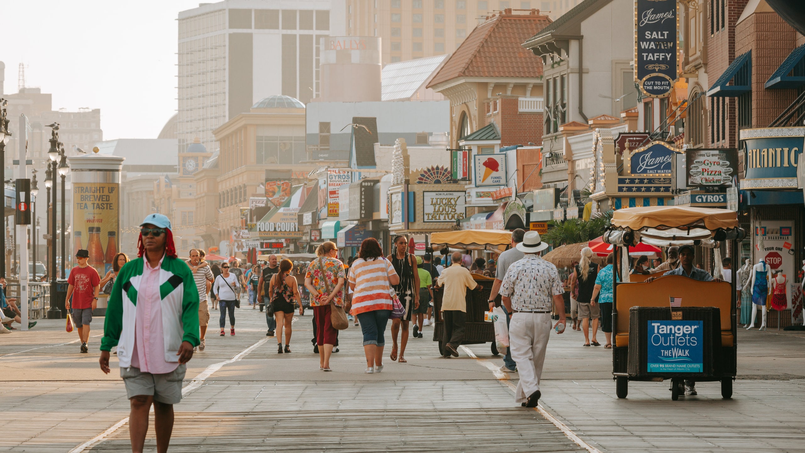 Atlantic City Boardwalk featuring a sunset and street scenes