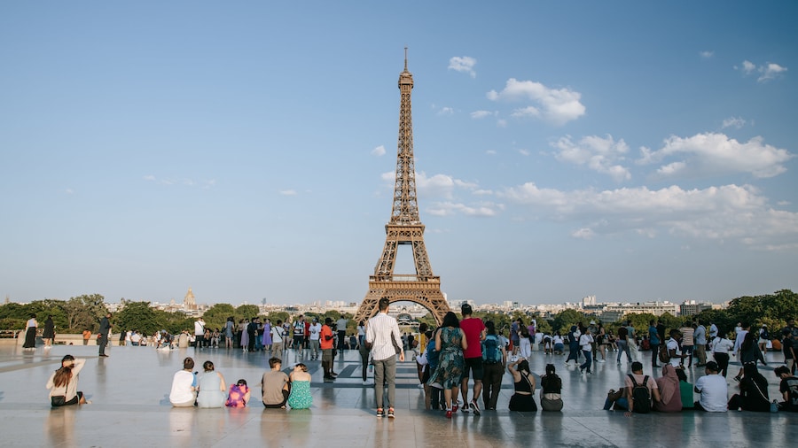 Tourists enjoying views of the Eiffel Tower in Paris, France.