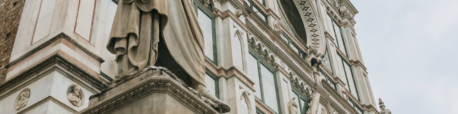 Basilica of Santa Croce showing a statue or sculpture, a church or cathedral and heritage elements