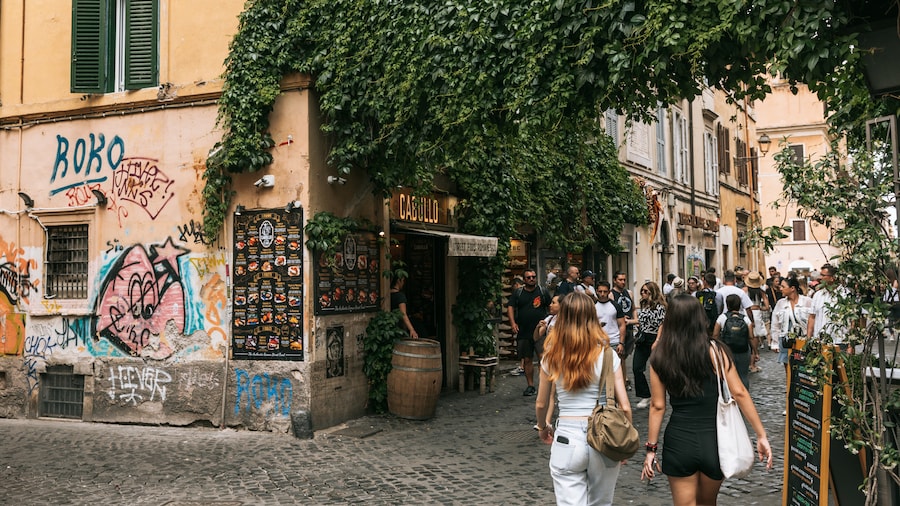 Cobblestone streets and ivy-covered buildings in Trastevere, Rome's bohemian quarter.