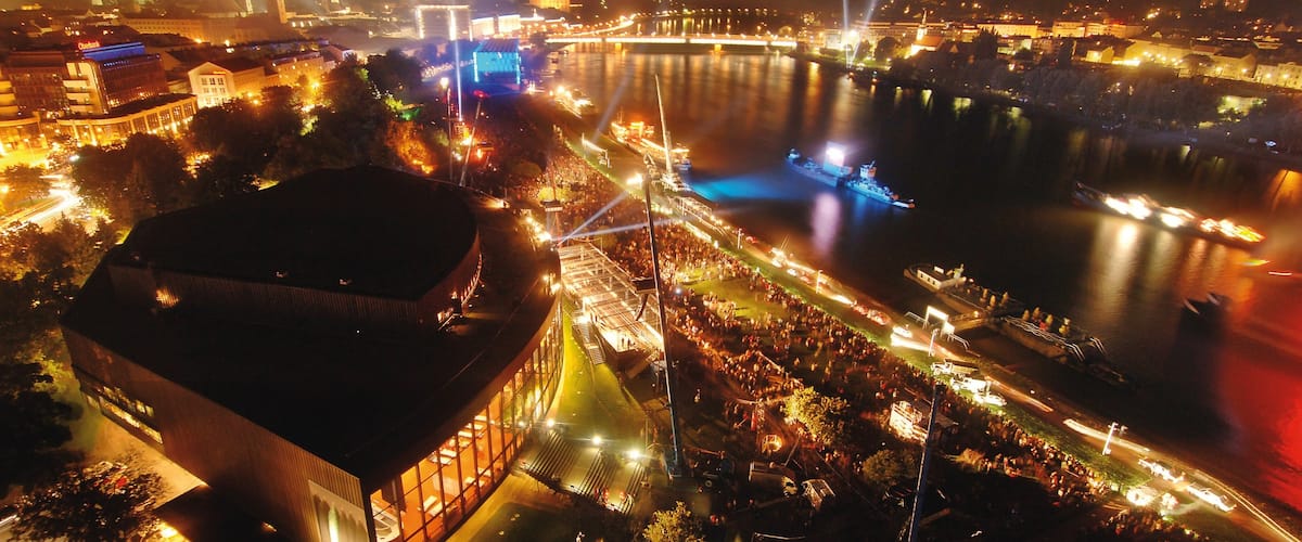 Linz showing boating, a river or creek and night scenes