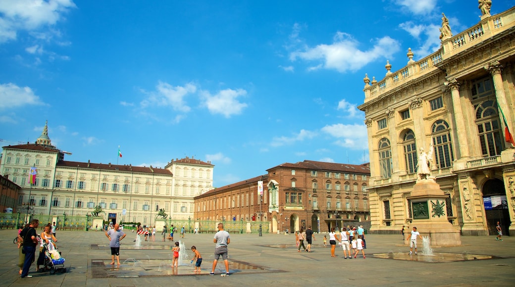 Turin featuring a fountain, heritage architecture and a square or plaza