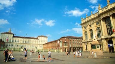 Turin featuring a fountain, heritage architecture and a square or plaza