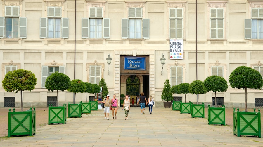 Turin Royal Palace which includes a castle and heritage architecture as well as a small group of people