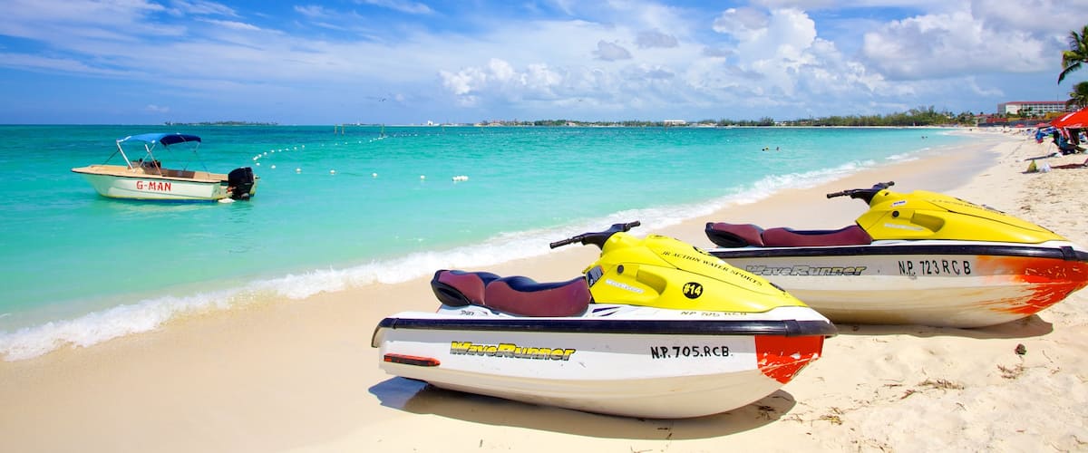 Cable Beach featuring jet skiing, a sandy beach and tropical scenes