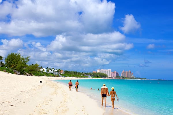 Cabbage Beach showing a coastal town, swimming and a beach