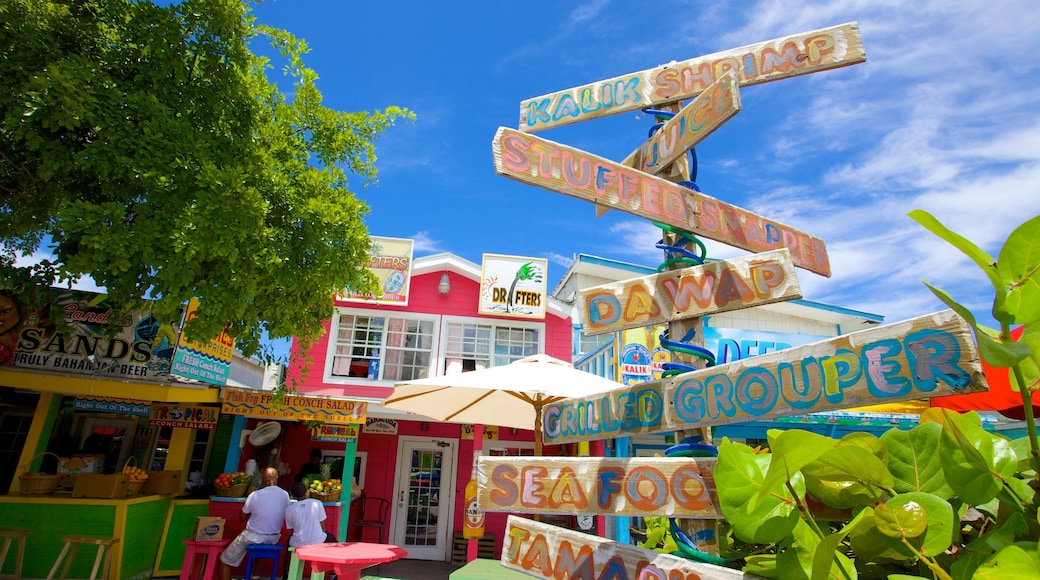 Arawak Cay featuring signage, street scenes and a small town or village