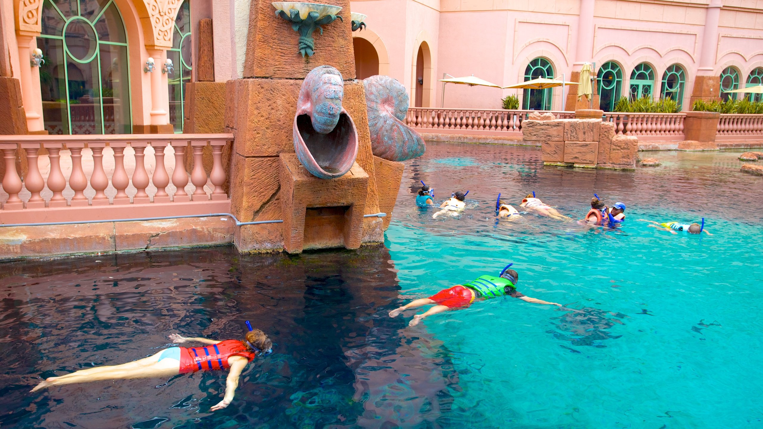 Atlantis Aquarium featuring snorkeling, marine life and a pool