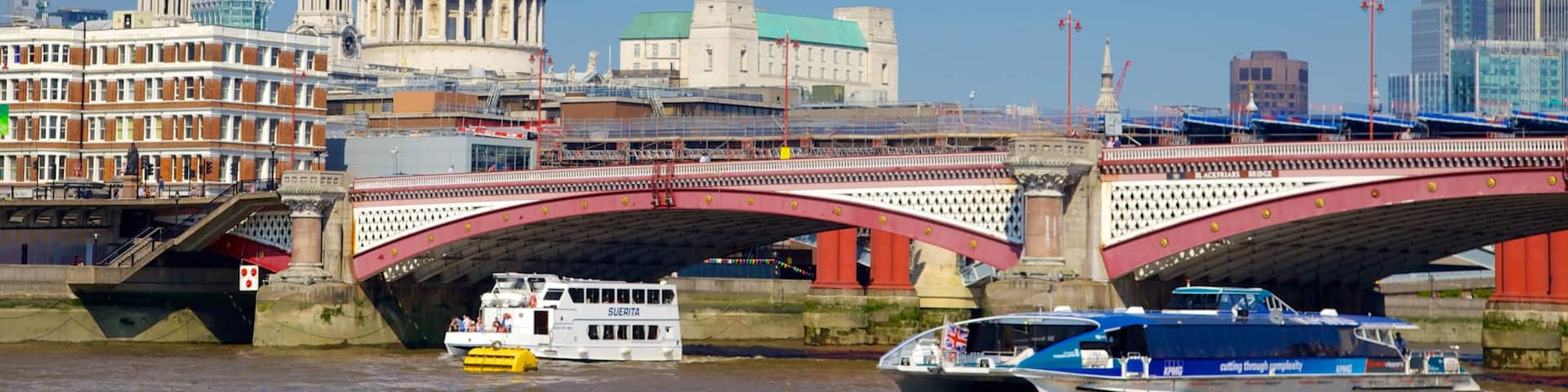 London showing a bridge, a river or creek and heritage architecture