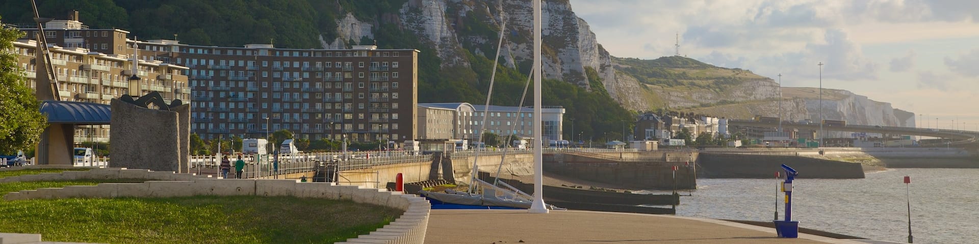 Dover Beach which includes mountains, a sandy beach and a coastal town