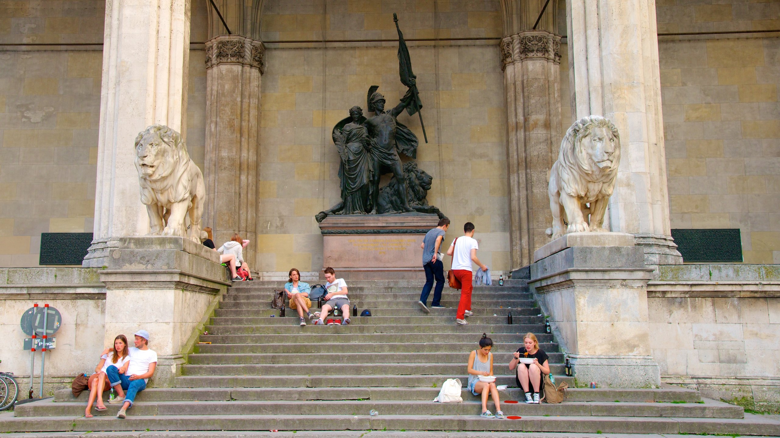 Odeonsplatz showing a statue or sculpture, a city and street scenes