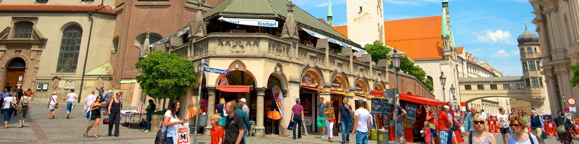 Viktualienmarkt showing street scenes, a church or cathedral and heritage architecture