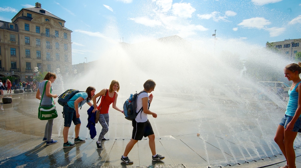 Karlsplatz - Stachus which includes a square or plaza, a city and a fountain
