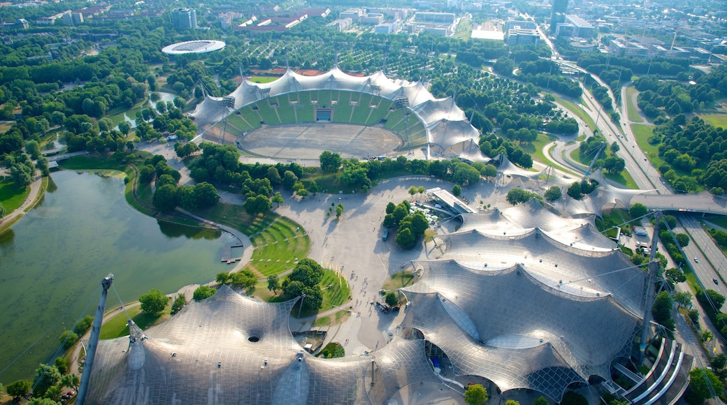 Olympic Tower which includes modern architecture and a pond