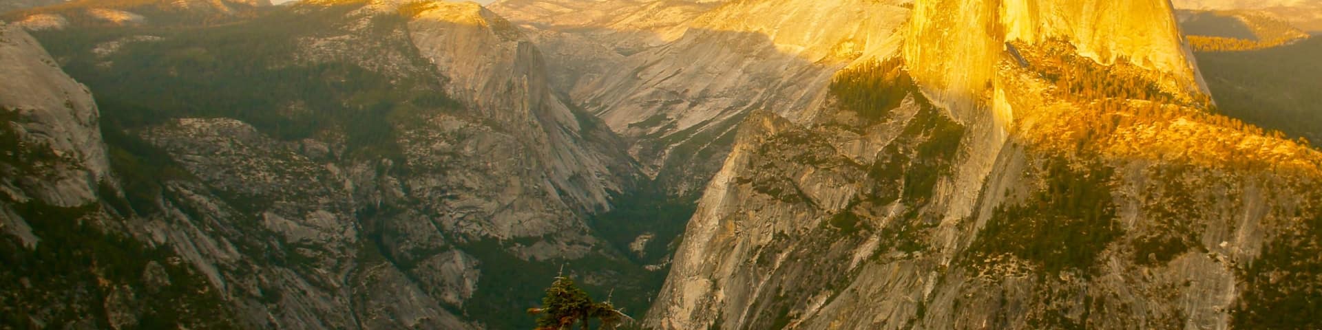 Yosemite Valley featuring a sunset, mountains and a gorge or canyon