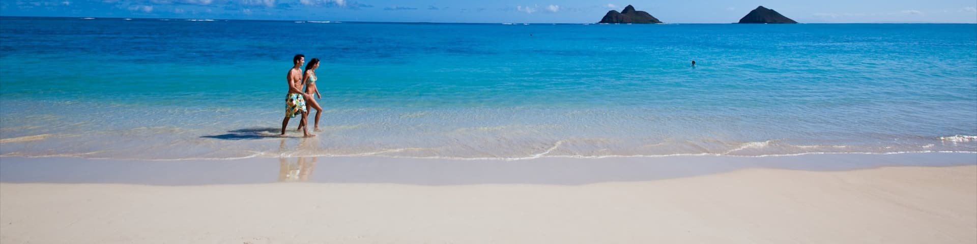 Kailua Beach showing a sandy beach and landscape views as well as a couple