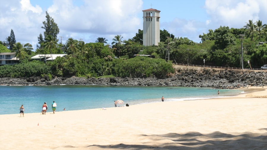 Waimea Bay which includes landscape views, a coastal town and a sandy beach