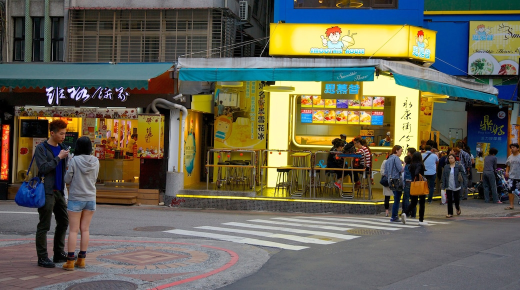 Yong Kang Street showing a city, cafe scenes and street scenes