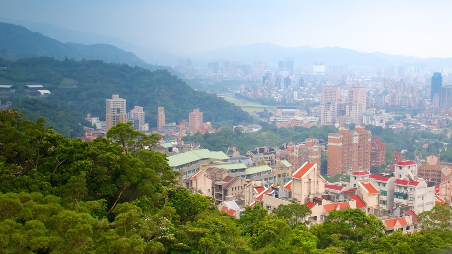 Maokong Gondola featuring mountains, a high rise building and a city