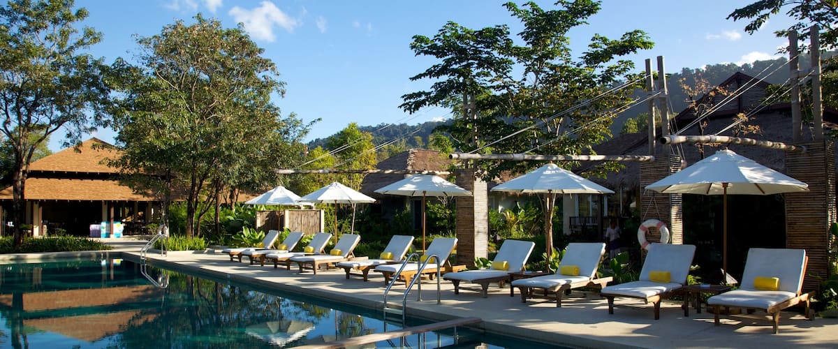 Trat showing a pool and a luxury hotel or resort