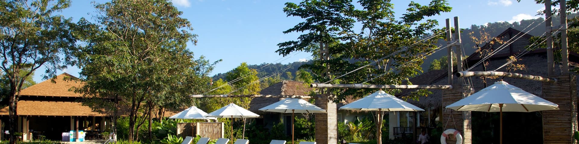 Trat which includes a luxury hotel or resort and a pool