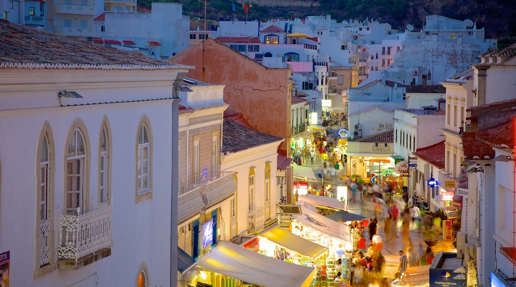 Albufeira which includes a small town or village, street scenes and nightlife